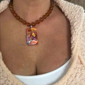 Necklace with picks up all the lights